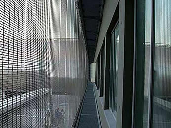 Media metal mesh without LED is installed as the outdoor facade screen of a building.
